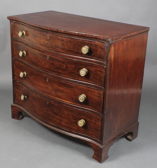 A George III mahogany chest of serpentine outline, the top inlaid satinwood stringing, fitted 4 long drawers with brass escutcheons, raised on bracket feet 39 1/2"h x 43"w x 21 1/2"d 