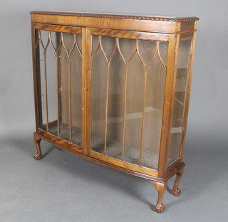 A Georgian style mahogany bow front display cabinet enclosed by astragal glazed doors, raised on cabriole ball and claw supports 48"h x 47"w x 14"d (no shelves)