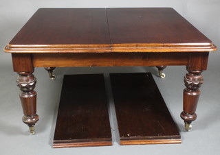 A Victorian mahogany extending dining table with 2 extra leaves, raised on turned supports 29 1/2"h x 55" without leaves x 89 1/2" with leaves inserted by 49 1/2"w