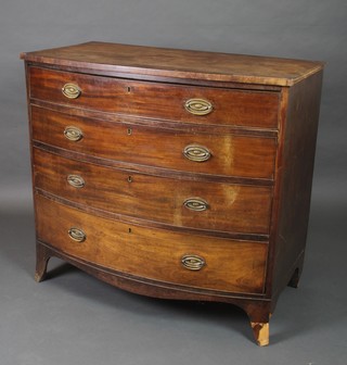 A George III mahogany bow front chest of 4 long drawers, the top drawer is fitted and with brass swan neck drop handles, raised on bracket feet 39"h x 42 1/2"w x 24"d