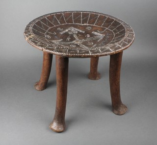A Ugandan circular hardwood stool inlaid stones, raised on 3 turned supports 15"h x 16" diam. 