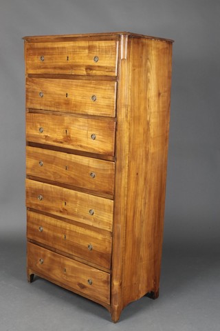 A 19th century continental fruitwood chest of 7 drawers with circular brass handles 57.5"h x 30"w x 16.5"d