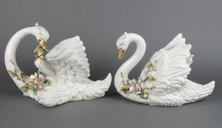 Two 20th Century Continental figures of reclining swans with gilt decoration 12" 
