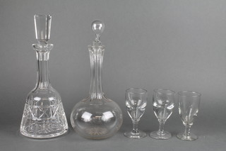 A mallet shaped decanter, 1 other and 3 glasses
