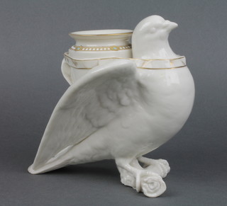 A Victorian Royal Worcester white glazed figure of a dove carrying a classical vase with gilt and turquoise decoration 7" 