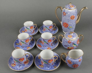 An early 20th Century Japanese tea set, the blue ground decorated with birds and flowers 