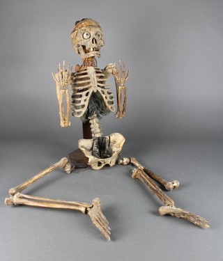 An early 20th Century medical student's plastic skeleton 45" in length 