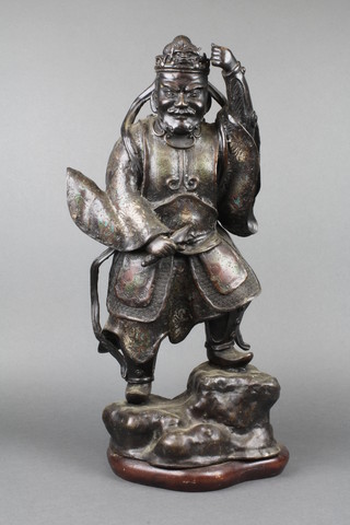 A 19th Century Japanese bronze and cloisonne enamelled figure of a standing Samurai Warrior, raised on a rocky outcrop, mounted on a wooden base 20"h 