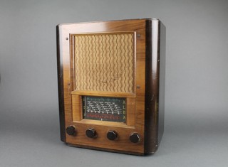 An Alba radio contained in a walnut finished case 