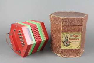 A German Regal concertina with 21 buttons complete with original box 