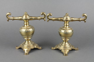 A pair of Victorian brass fire dogs of bulbous form raised on panel supports 8" 