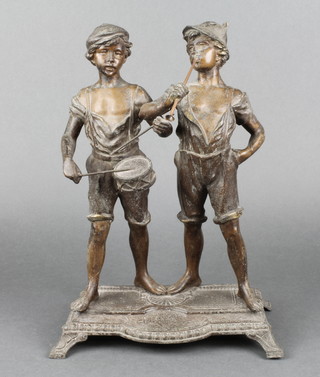 A 19th Century spelter figure group of standing drummer boy and horn blower, raised on a shaped base (f) 13" 