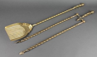 A 19th Century reeded brass coal shovel together with a ditto poker (f)