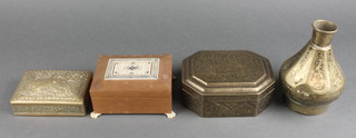 A rectangular sandalwood and inlaid ivory trinket box with hinged lid, raised on 4 paw supports 2"h x 3 1/2"w x 4 1/2"d (4" split to the top of the box), an embossed Persian brass box with hinged lid 1"h x 4"w x 3"d, an Indian octagonal brass box and a waisted brass vase 5" 