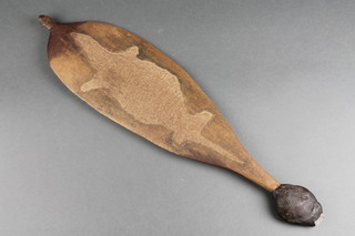 A curious Australian carved teak and flint mounted spear thrower, carved a platypus 22"h x 5 1/2"w 
