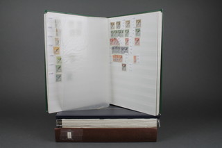A green stock book of various German used stamps and 3 other stock books of World used stamps 