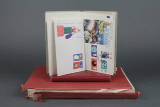 A red stock of used World stamps together with a small red album of world stamps and a small stock book of stamps 