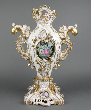 An early 20th Century Rococo style 2 handled vase decorated with panels of flowers 17" 