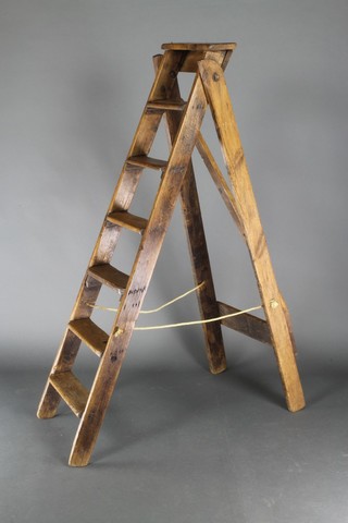 For decorative purposes only, a pair of 19th/20th Century 7 tread elm platform steps