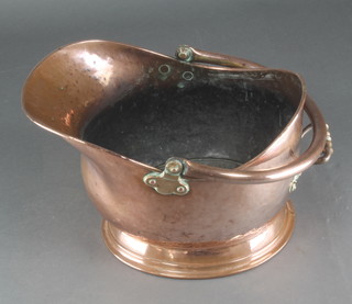 A polished copper helmet shaped coal scuttle 12" 