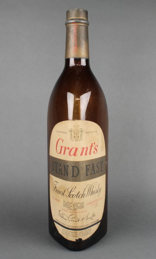 A large Grants Scotch whisky advertising bottle 133 1/2 fluid ounces  