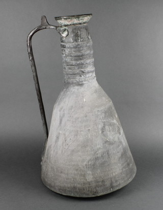 A Persian planished copper jug 20" 