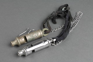 A Hants Constabulary Metropolitan patent police whistle together with a Metropolitan patent whistle and chain 