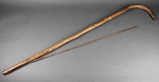 A Victorian stick incorporating a bow saw 