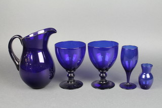 A pair of Bristol blue glass goblets 6", ditto jug and 2 other items