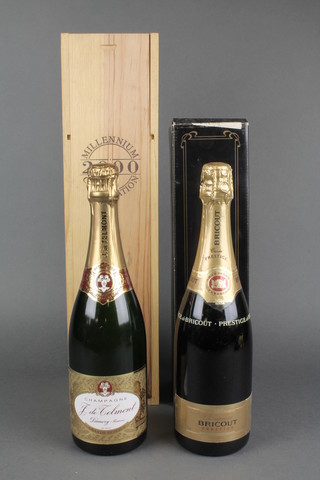 A J. de Telomont, a bottle of 2000 Millenium grand reserve champagne together with a bottle of Bricout champagne