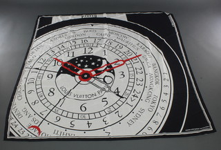 Louis Vuitton Paris, a 1988 limited edition black silk scarf decorated a clock dial and marked Montre Louis Vuitton I Par Gae Aulenti 54" x 53", labelled silk made in Italy
