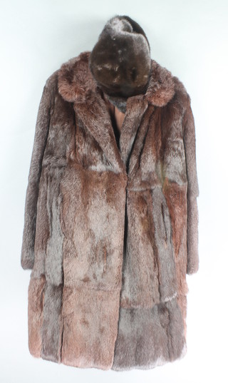 A lady's half length brown mink coat