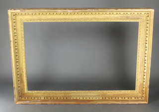 A Victorian gilt picture frame with bull and dart decoration, the opening 50" x 32 1/2" 