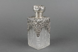 An Edwardian silver mounted cut glass square toilet bottle, Birmingham 1902 