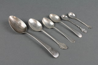 A Georgian silver dessert spoon, 5 others 