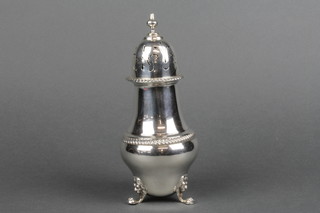 A silver baluster sugar shaker with gadrooned decoration on lion mask and claw feet London 1909, 214 grams