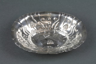 An 18th Century German repousse silver oval dish decorated with simple vinous decoration 7" 