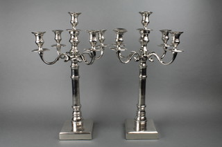 A pair of contemporary 5 light silver plated candlesticks on square bases 21" 