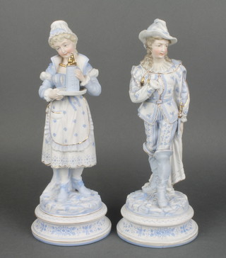 A pair of 19th Century German bisque figures of a lady and gentleman on raised rustic bases 12" 