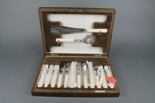 A set of silver fish eaters for 6 with servers, in an oak canteen 