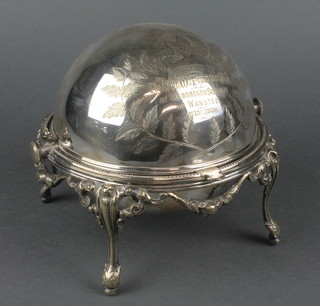 An Edwardian silver plated chased swivel butter dish on raised scrolled feet