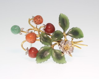 An 18ct yellow gold floral and fruit spray brooch consisting diamonds, jade, pearl and emeralds