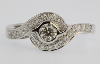 A 14ct  yellow diamond set whorl ring, size R