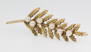 A 9ct gold pearl set leaf brooch
