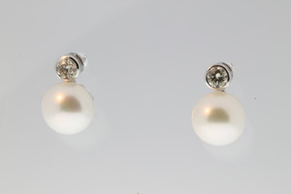 A pair of 18ct white gold diamond and pearl drop ear studs, the diamonds approx. 0.4ct 