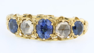 An 18ct yellow gold sapphire and diamond ring, the 2 diamonds approx 0.2ct each, flanked by 3 sapphires, size M