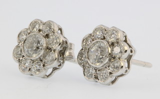 A pair of 18ct white gold diamond cluster ear studs, approx 0.9ct