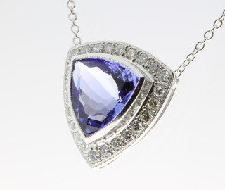 An 18ct gold tanzanite and diamond triangular pendant, the centre stone approx. 2.6ct surround by 0.3ct of diamonds 