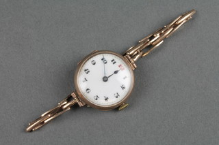 A lady's 9ct gold wristwatch on a ditto bracelet