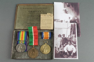 A World War One group of medals comprising British War medal, Victory medal and Mercantile Marine medal to Lieut. J. Brown. R.N.R. together with 2 facsimile photographs of the recipient 